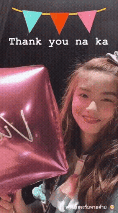 A Girl Holding A Pink Balloon That Says Thank You GIF