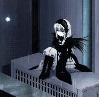 A Girl In A Black And White Dress Sits On A Radiator GIF