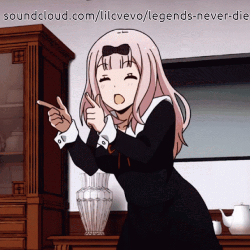 A Girl In A Black Dress Is Pointing At Something With Soundcloud.com In The Corner GIF