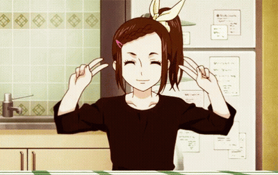 A Girl In A Black Shirt Is Making A Peace Sign With Her Hands GIF