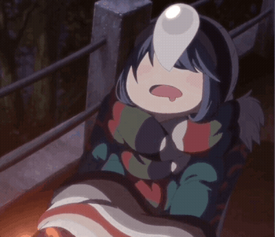 A Girl In A Blanket With A Light On Her Face GIF