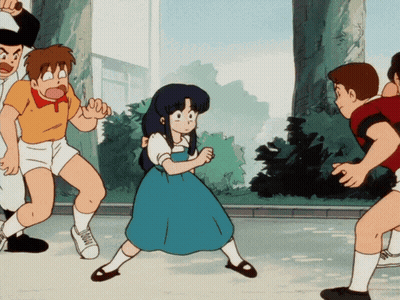 A Girl In A Blue Dress Is Surrounded By Boys GIF