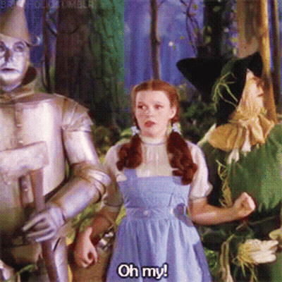 A Girl In A Blue Dress Says " Oh My " GIF