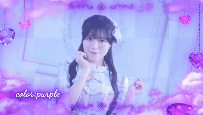A Girl In A Blue Dress Stands In Front Of A Purple Background With The Words Color Purple Written On It GIF