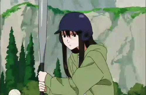 A Girl In A Blue Helmet Is Holding A Bat GIF