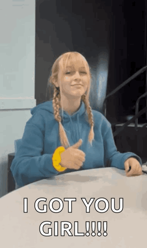 A Girl In A Blue Hoodie Is Giving A Thumbs Up And Saying I Got You Girl GIF