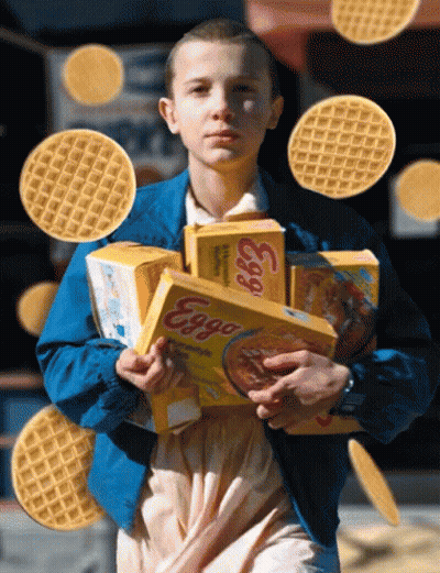 A Girl In A Blue Jacket Holds Boxes Of Eggs Cereal GIF