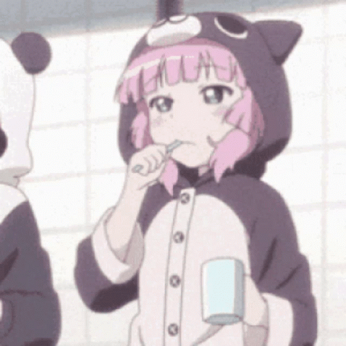 A Girl In A Cat Costume Is Brushing Her Teeth And Holding A Cup GIF