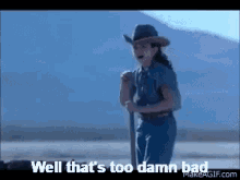 A Girl In A Cowboy Hat Is Holding A Shovel And Says Well That 'S Too Damn Bad GIF