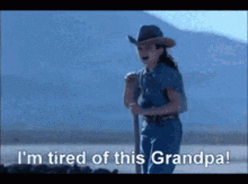 A Girl In A Cowboy Hat Is Saying I 'M Tired Of This Grandpa . GIF