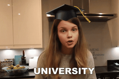 A Girl In A Graduation Cap Says University In A Kitchen GIF
