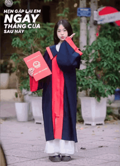 A Girl In A Graduation Gown Holds A Certificate GIF