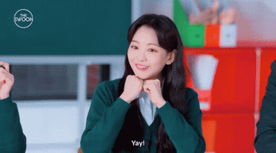 A Girl In A Green Shirt Says Yay GIF