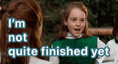 A Girl In A Green Vest With The Words I 'M Not Quite Finished Yet Above Her GIF