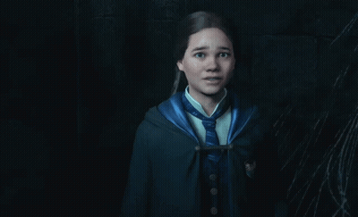 A Girl In A Harry Potter Uniform Is Standing In A Dark Room With A Spider Web In The Background GIF