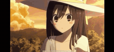 A Girl In A Hat Is Standing In A Field . GIF