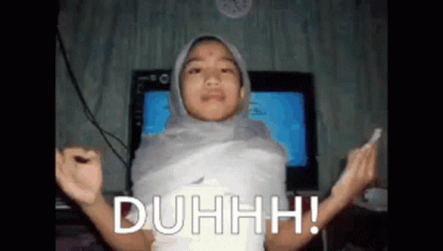 A Girl In A Hijab Is Wrapped In A Piece Of Paper And Says Duhhhh GIF