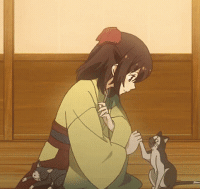 A Girl In A Kimono Holds The Paw Of A Cat GIF