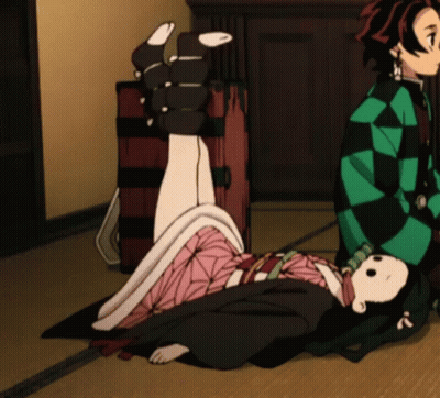A Girl In A Kimono Is Laying On The Floor Next To A Man GIF