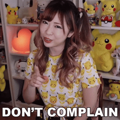 A Girl In A Pikachu Shirt Says " Do N't Complain " In Front Of Stuffed Pikachus GIF