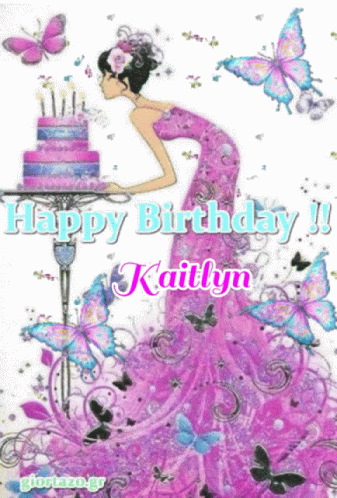 A Girl In A Pink Dress Is Blowing Out Candles On A Cake GIF