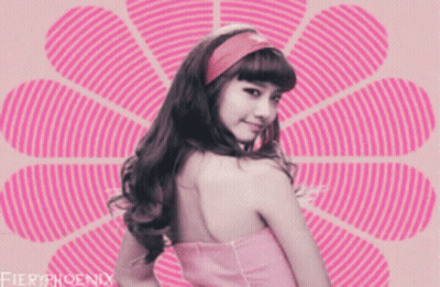 A Girl In A Pink Dress Is Standing In Front Of A Pink Flower With Fieryphoenix Written On The Bottom GIF