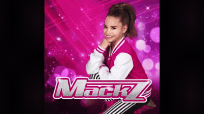 A Girl In A Pink Jacket And Striped Pants Is Standing In Front Of A Pink Background With The Word Mackz . GIF