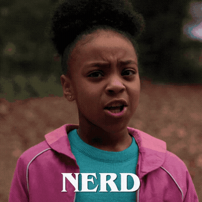 A Girl In A Pink Jacket With The Word Nerd Written On It GIF