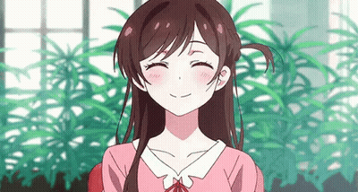 A Girl In A Pink Shirt Is Smiling With Her Eyes Closed In Front Of A Window . GIF