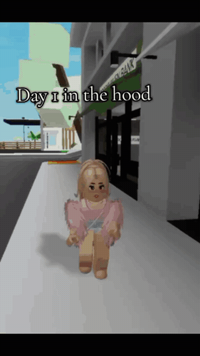 A Girl In A Pink Shirt Is Walking Down A Sidewalk With The Words Day I In The Hood Below Her GIF