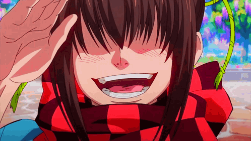 A Girl In A Red And Black Scarf Is Smiling GIF