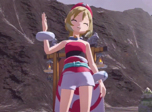 A Girl In A Red And White Dress Is Standing In Front Of Mountains GIF