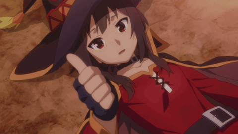A Girl In A Red Dress And Black Hat Gives A Thumbs Up GIF