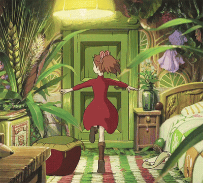 A Girl In A Red Dress Is Standing In Front Of A Green Door Surrounded By Plants . GIF