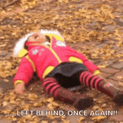 A Girl In A Red Jacket Is Laying On The Ground With The Words Left Behind Once Again GIF