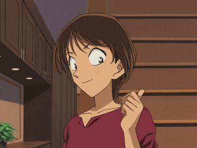 A Girl In A Red Shirt Is Pointing At Something GIF