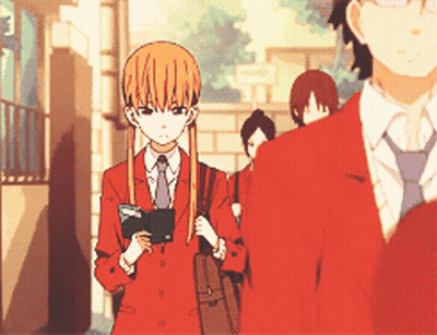 A Girl In A Red Suit And Tie Is Standing Next To A Man In A Red Suit GIF