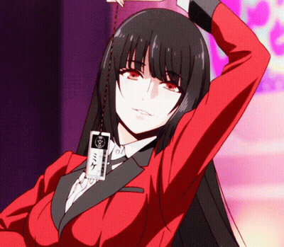 A Girl In A Red Suit Has A Card Around Her Neck That Says ' Mike ' On It GIF