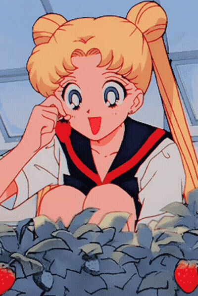 A Girl In A Sailor Suit Is Eating A Strawberry In A Garden GIF