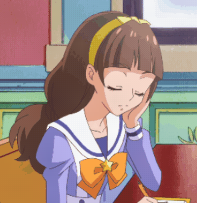 A Girl In A Sailor Suit With A Star On Her Head Is Sitting At A Table With Her Eyes Closed GIF