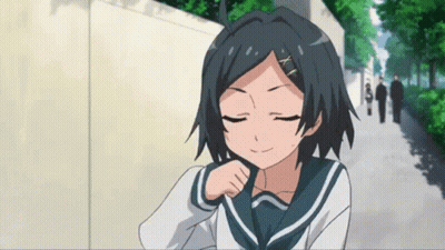 A Girl In A School Uniform Has Her Eyes Closed And Is Smiling GIF