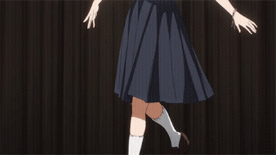 A Girl In A School Uniform Is Doing A Split With Her Legs In The Air GIF