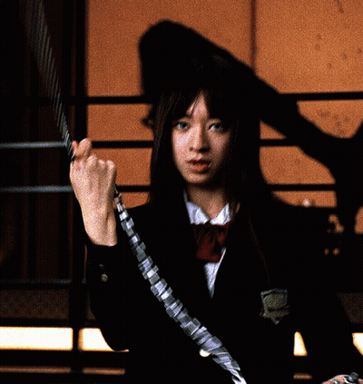 A Girl In A School Uniform Is Holding A Chain Around Her Wrist GIF