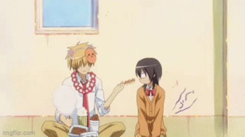 A Girl In A School Uniform Is Holding A Piece Of Food GIF