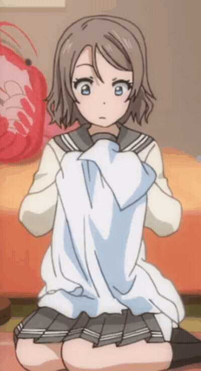 A Girl In A School Uniform Is Kneeling On The Floor GIF