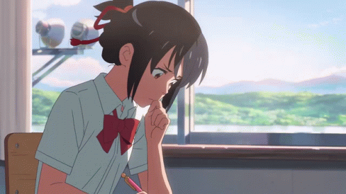 A Girl In A School Uniform Is Sitting In Front Of A Window With A Pencil In Her Hand GIF