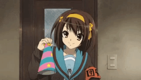 A Girl In A School Uniform Is Standing In Front Of A Door Holding A Blanket . GIF