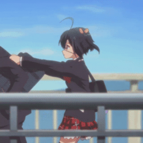 A Girl In A School Uniform Is Standing Next To A Man On A Bridge GIF