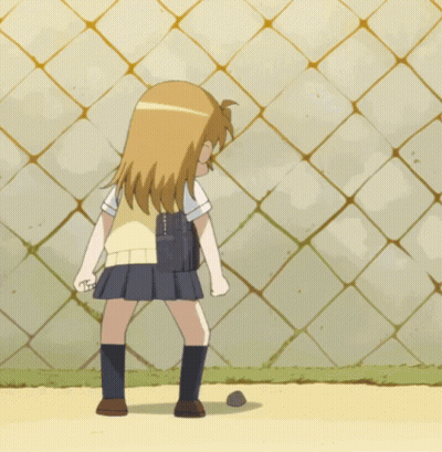 A Girl In A School Uniform Kicking A Ball GIF