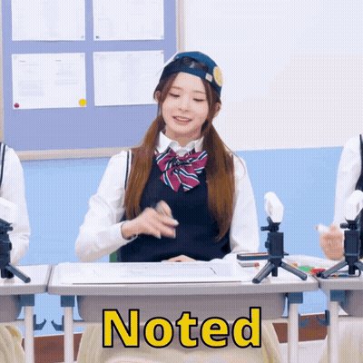 A Girl In A School Uniform Sits At A Desk With The Word Noted On The Front GIF